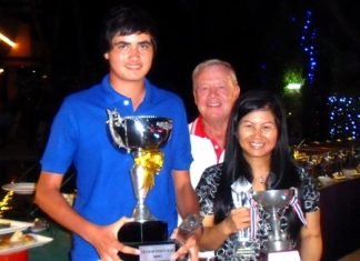 Kelly and Emmerson prove star turns at Kheow Kheow Men’s and Ladies Annual Club Champions, Patrick Kelly, left, and Ngamjit Emmerson, right, hold their trophies while the PSC Golf Chairman Joe Mooneyham stands center rear.